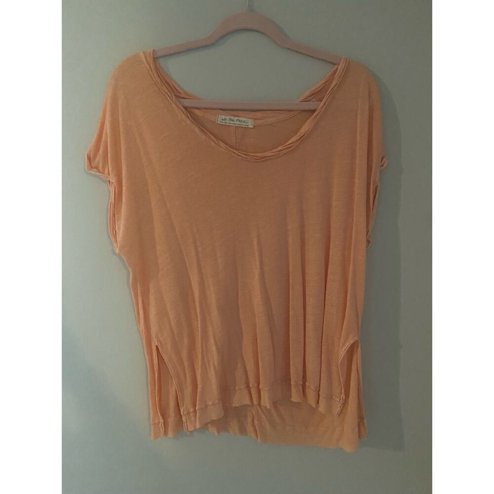 We The Free Peach/Orange Dip Distressed top